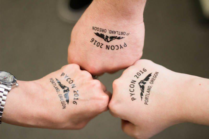 Caktus staff show off their PyCon 2016 temporary tattoos.