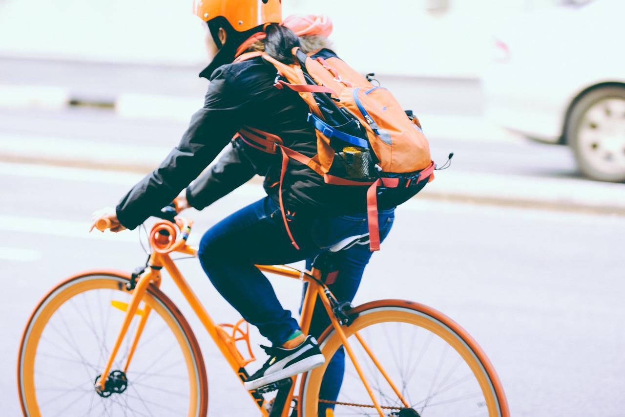 Riding a bicycle to work.