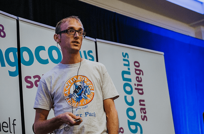 Carlton Gibson on stage during his presentation at DjangoCon.