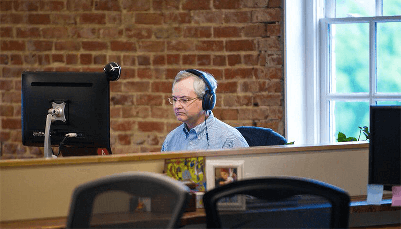 Developer Dan Poirier at work on his computer.