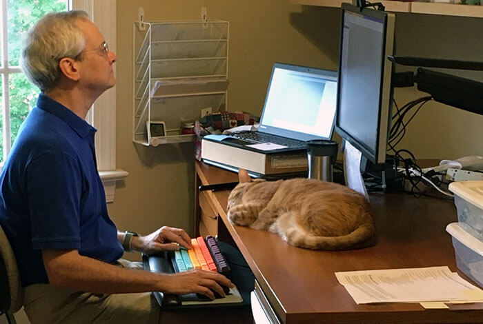 Developer working on a computer at home