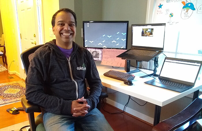 Developer and blog author Vinod Kurup working at his desk at home