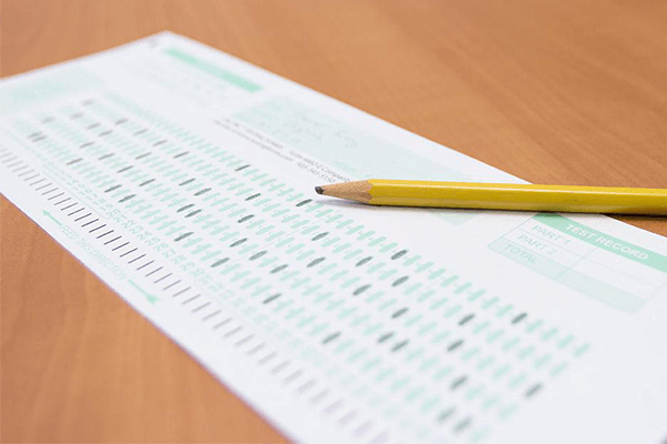 A paper survey and pencil on a desk.