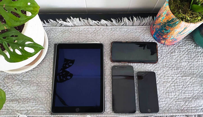 Various mobile devices, including an iPad and iPhone, used for accessibility testing
