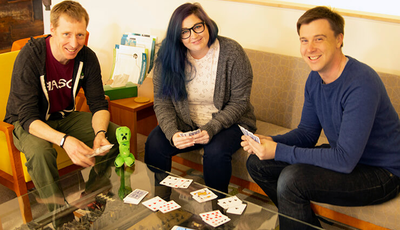Scott, Kat, and Tim take a quick break for a game of cards