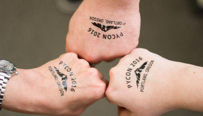 Caktus staff show off their PyCon 2016 temporary tattoos.